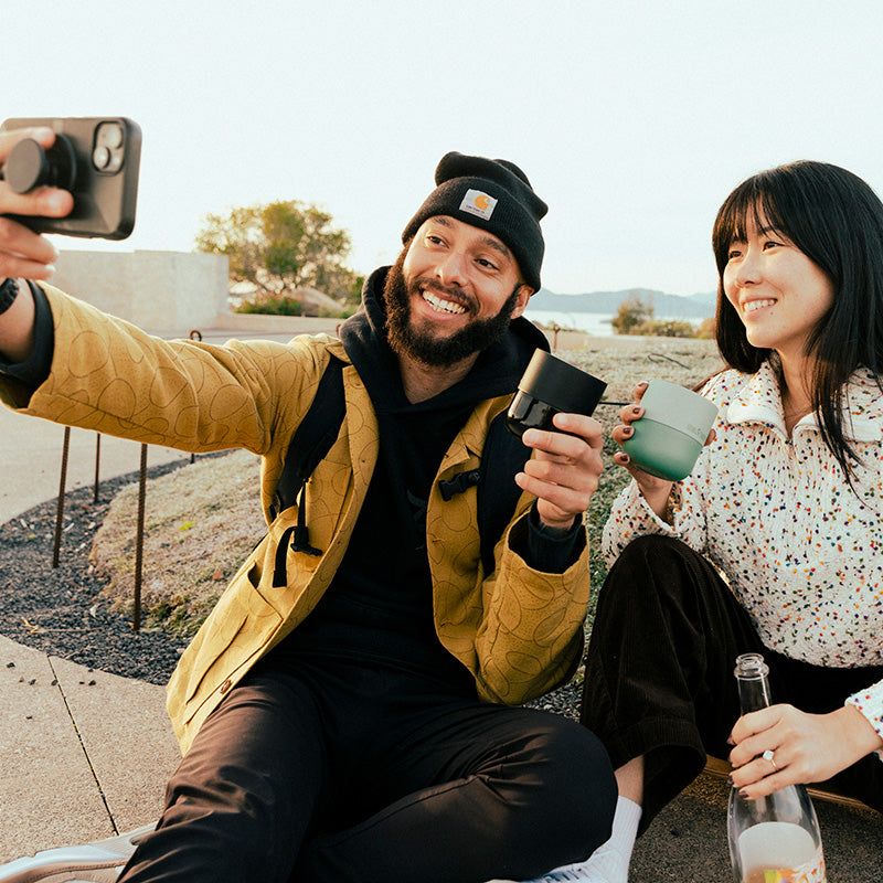 bring-your-own-party-kit-tumblers-and-cocktails-m3 8oz_rise_lowball_black_iceberg_couple_selfie_city_square.jpg