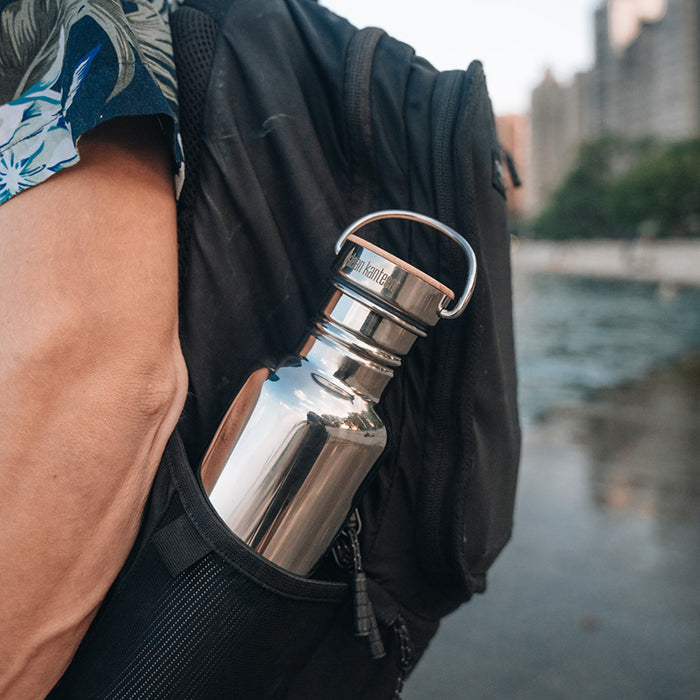 27oz-reflect-with-bamboo-cap-f9 K27SSLRF-MS-BAMBOO_reflect-bottle_backpack_lifestyle.jpg