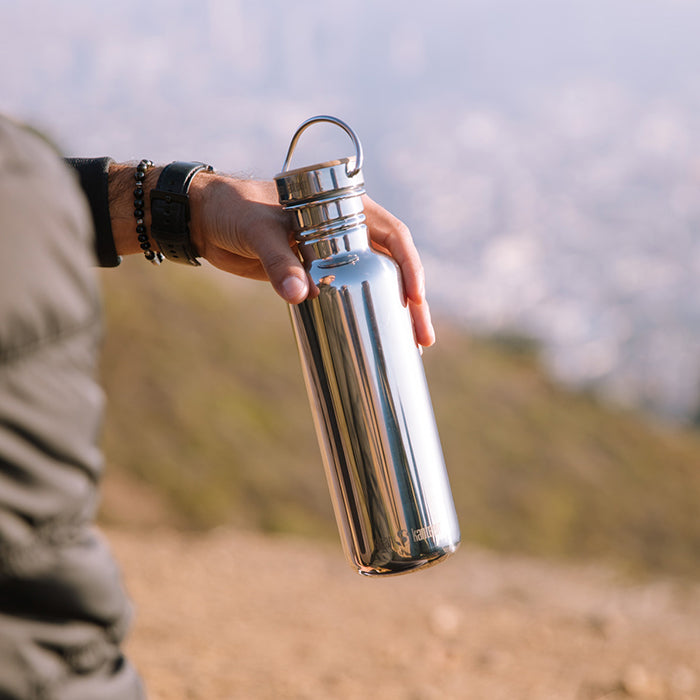 27oz-reflect-with-bamboo-cap-f9 K27SSLRF-MS-BAMBOO_reflect_bottle_hand_lifestyle.jpg